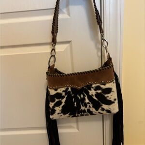 Designer Custom Leather cowhide handbag in excellent condition.